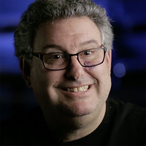 Irwin Appel wears a black shirt in a blue room