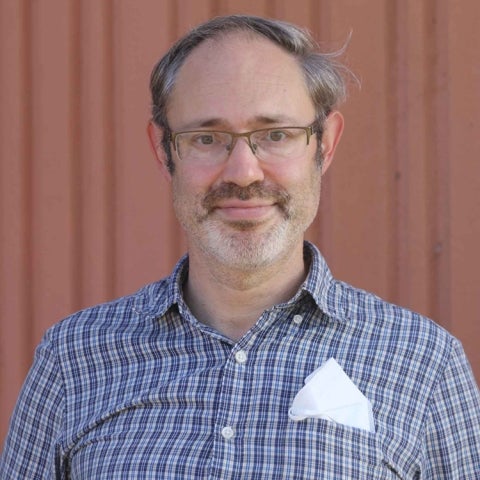 Jason Turowetz wears a collared shirt