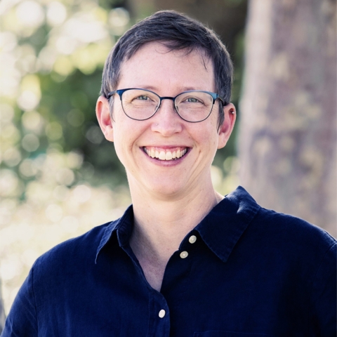 Kate McDonald wears a dark navy shirt outside