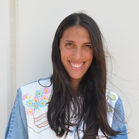Kathryn Beheshti wears a denim jacket