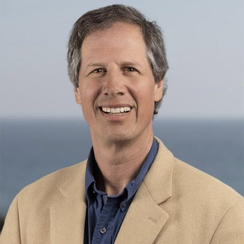 James Salzman wears a tan blazer over a dark blue collared shirt