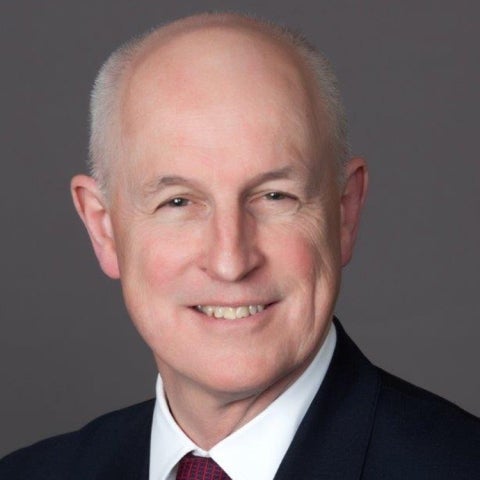 Ian Duncan wears a dark suit