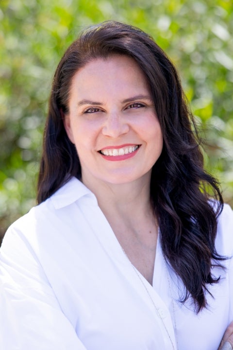 white woman with long brown hair and smile