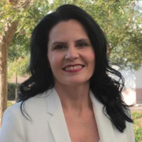 Tamara Afifi wears a white blazer outside