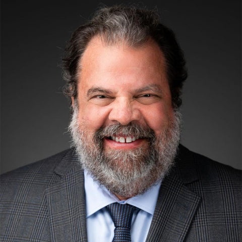 Michael Miller wears a suit