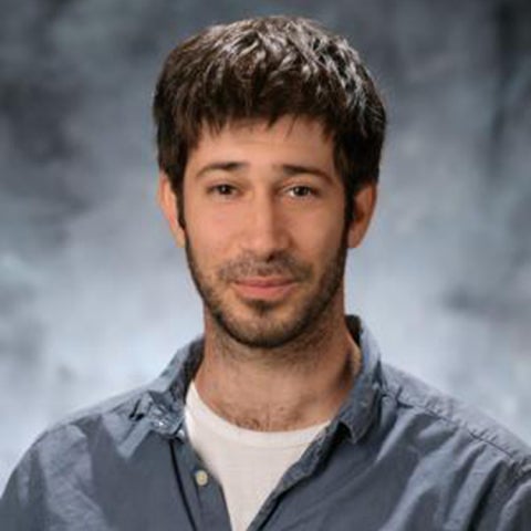 Lior Sepunaru wears a blue-gray collared shirt