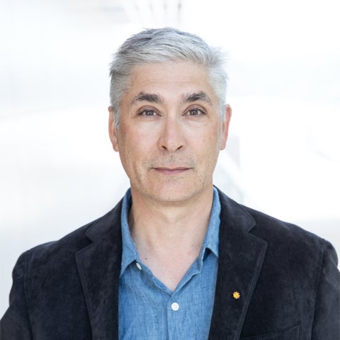 W. Patrick McCray wears a dark blazer over a blue collared shirt