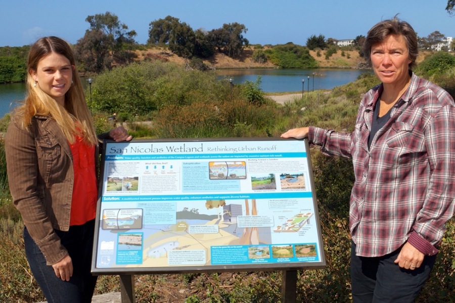 Lisa Stratton, CCBER director of ecosystem management, right, with Jenna Driscoll, from both UCSB’s Bren School of Environmental Science &amp; Management, and the Coastal Fund, which funded the new signs.