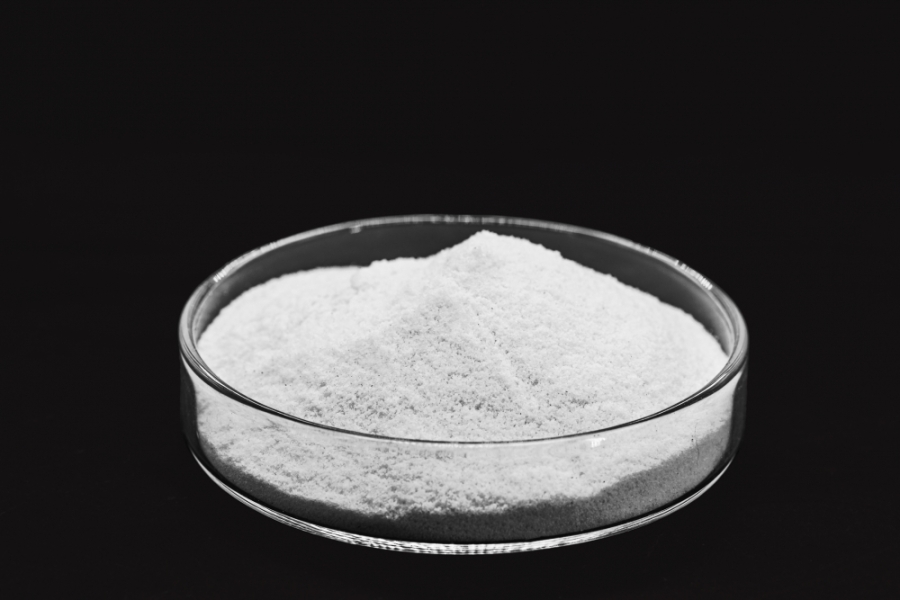 white powder in petri dish against black background
